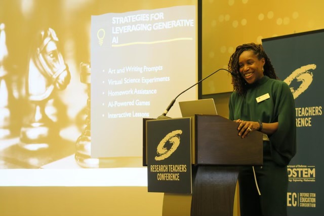 Image of Gabriella Waters speaking at lectern